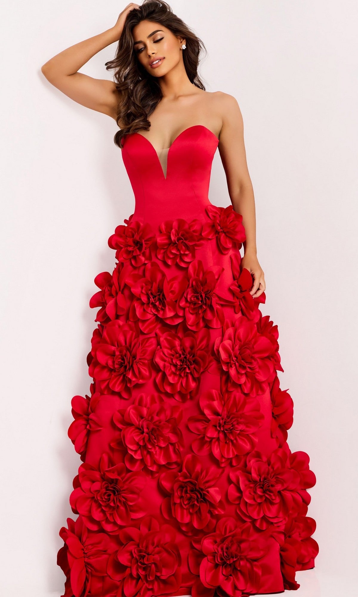 A woman models the Jovani 45661 long prom dress with a strapless sweetheart neckline, fitted bodice, and deep red skirt adorned with large 3D floral appliqués, standing against a plain background.